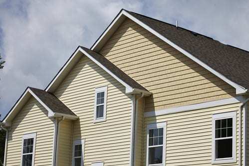 Residential house with cream siding
