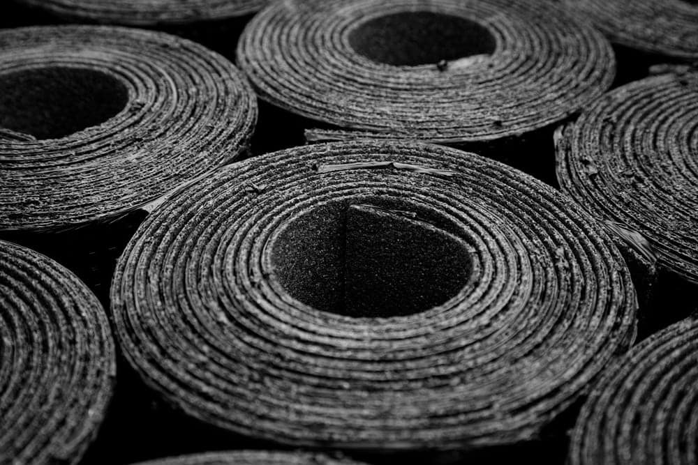 Rolls of black roofing material