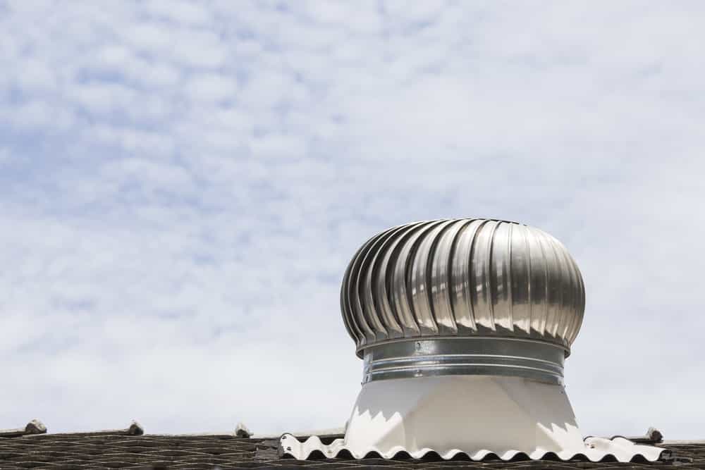 Roof of building with wind turbine (vent)