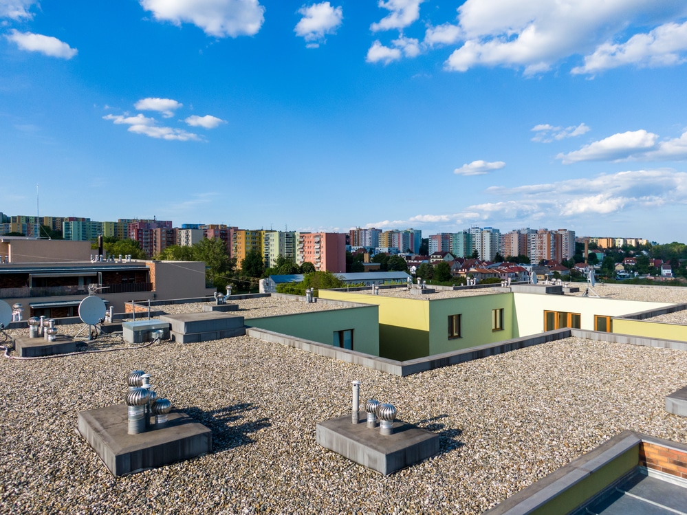 Flat building roof, blue sky