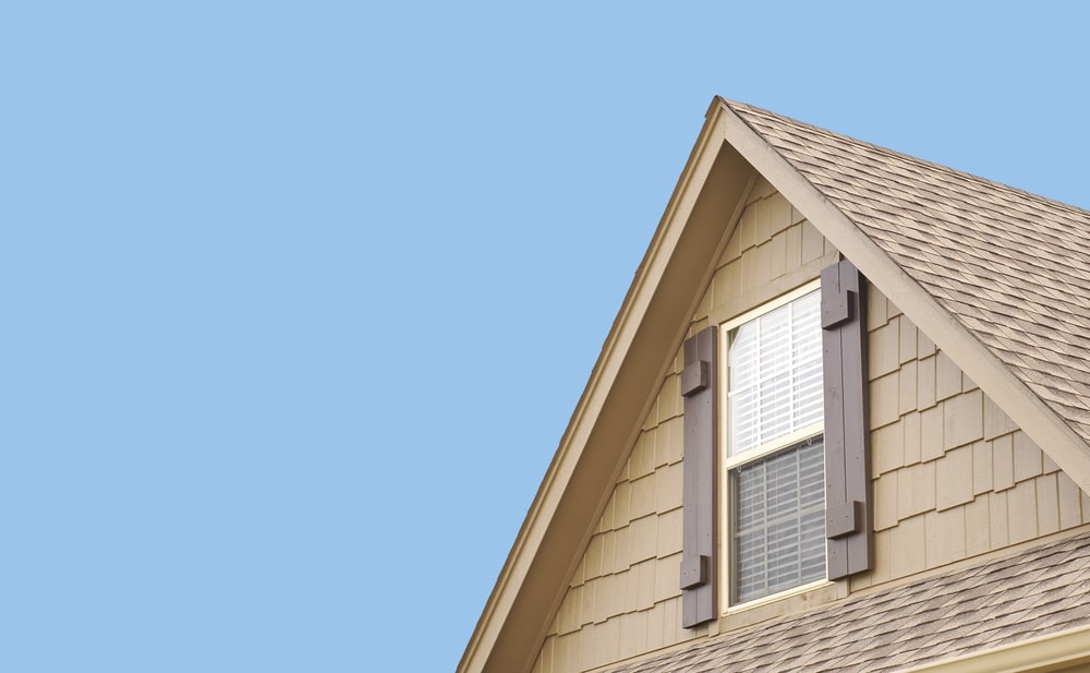 Close up of roof gable against blue sky