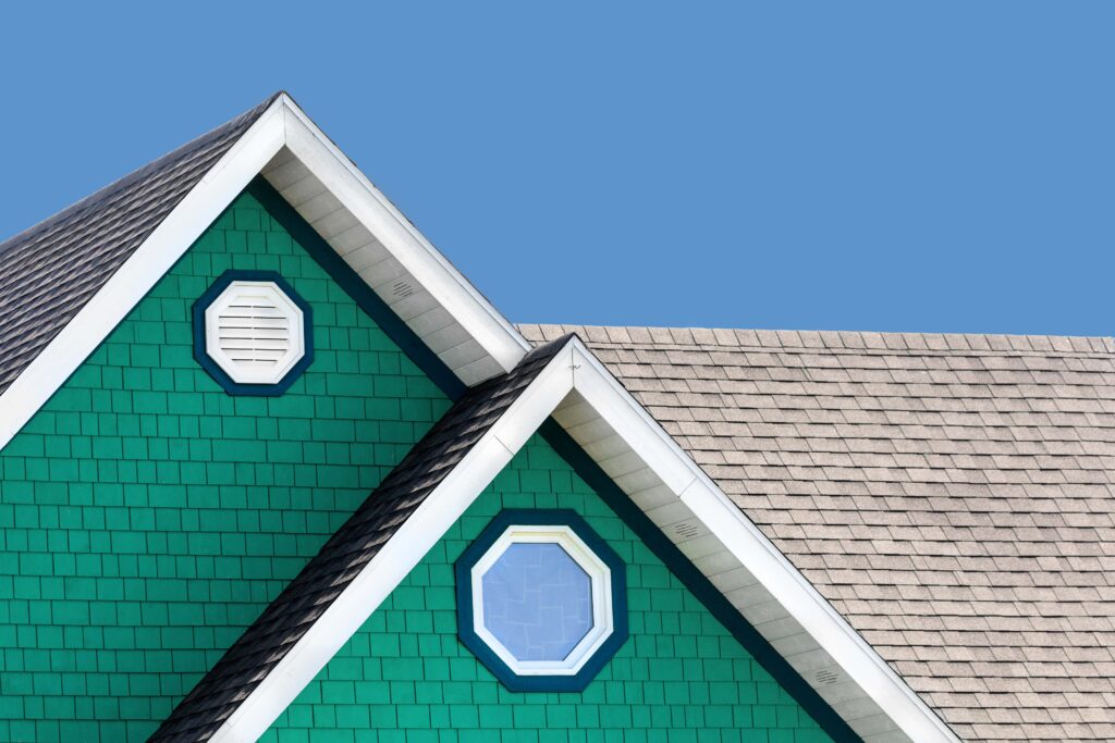 Roof with light colored shingles, blue sky