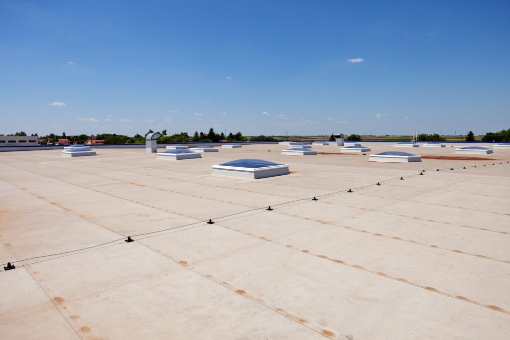 Flat commercial roof, blue sky