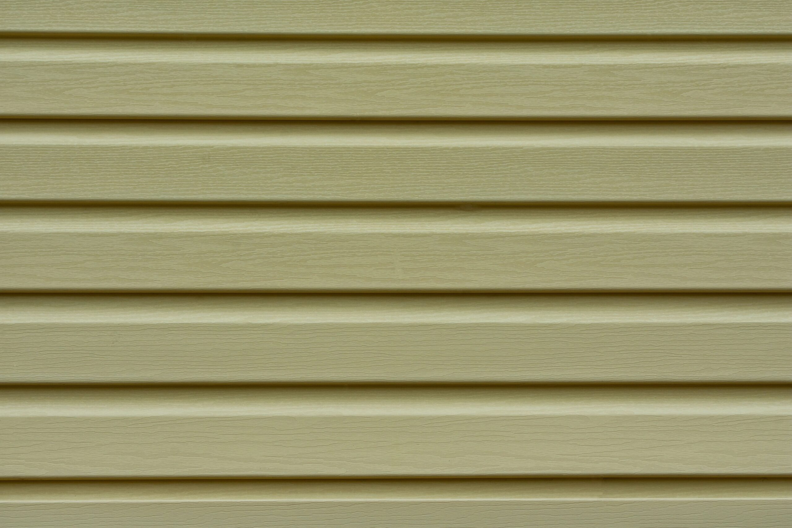 Close-up of green siding